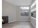 Bright living room with fireplace, hardwood floors, and large windows offering natural light at 8228 Lauderdale Ct, Las Vegas, NV 89128