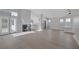 Spacious living room with fireplace and access to backyard with modern wood flooring at 8228 Lauderdale Ct, Las Vegas, NV 89128
