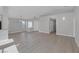 Large living space featuring hardwood floors and an open floorplan with bright natural light at 8228 Lauderdale Ct, Las Vegas, NV 89128