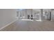 Open-concept living area with fireplace, hardwood floors, and lots of natural light at 8228 Lauderdale Ct, Las Vegas, NV 89128