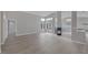 Bright living room with fireplace and doors that open to the outdoors at 8228 Lauderdale Ct, Las Vegas, NV 89128