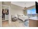 Bright bedroom with a city view, walk-in closet, plush rug, and seating area for relaxation at 8255 Las Vegas Blvd # 1422, Las Vegas, NV 89123