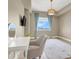 Sun-drenched bedroom with large window, stylish decor, and comfortable furnishings at 8255 Las Vegas Blvd # 1422, Las Vegas, NV 89123