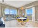 Dining area includes a round table set, floor-to-ceiling windows, and mountain views at 8255 Las Vegas Blvd # 1422, Las Vegas, NV 89123