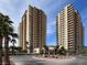 Exterior shot of high-rise condo buildings with balconies and beautifully landscaped grounds at 8255 Las Vegas Blvd # 1422, Las Vegas, NV 89123