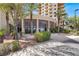Front entrance of community building with benches, trees, and circular architecture at 8255 Las Vegas Blvd # 1422, Las Vegas, NV 89123
