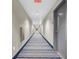 Long hallway with patterned carpet and modern lighting, providing access to units at 8255 Las Vegas Blvd # 1422, Las Vegas, NV 89123