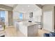 Bright kitchen features sleek white cabinetry, stainless steel appliances, and a large center island at 8255 Las Vegas Blvd # 1422, Las Vegas, NV 89123