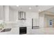 Bright kitchen boasts white cabinetry, stainless steel appliances, and marble backsplash at 8255 Las Vegas Blvd # 1422, Las Vegas, NV 89123