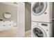 Efficient laundry area featuring stacked washer and dryer, ample storage, and convenient layout at 8255 Las Vegas Blvd # 1422, Las Vegas, NV 89123