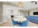 Bright living area seamlessly integrates the dining and kitchen areas with floor-to-ceiling windows at 8255 Las Vegas Blvd # 1422, Las Vegas, NV 89123