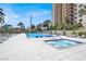 Community pool with hot tub and lounge chairs surrounded by lush landscaping at 8255 Las Vegas Blvd # 1422, Las Vegas, NV 89123