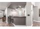 Finished basement area featuring a bar with barstool seating, sink, and shelving at 905 Possum Hill St, Henderson, NV 89014