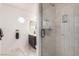 Updated bathroom featuring a glass door shower and a small window at 905 Possum Hill St, Henderson, NV 89014