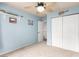 Bedroom with light blue walls, carpet flooring, and a double door closet at 905 Possum Hill St, Henderson, NV 89014