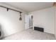 Spacious room with a mandolin hanging on the wall and an open doorway at 905 Possum Hill St, Henderson, NV 89014