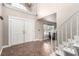 Bright and spacious foyer with tile flooring, double doors, and staircase provides a grand entrance at 905 Possum Hill St, Henderson, NV 89014