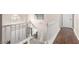 Hallway and Staircase features hardwood floors and white railings at 905 Possum Hill St, Henderson, NV 89014