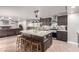 Spacious kitchen with a large island, stainless steel appliances, and an open layout into the living area at 905 Possum Hill St, Henderson, NV 89014