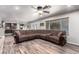 Spacious living room showcases an adjacent kitchen with bar seating and a comfortable sectional sofa at 905 Possum Hill St, Henderson, NV 89014