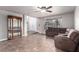 Spacious living room with tile flooring, large windows, and a cozy sofa create a welcoming atmosphere at 905 Possum Hill St, Henderson, NV 89014