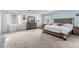 Expansive main bedroom offers neutral carpet, a large dresser, and great natural light at 905 Possum Hill St, Henderson, NV 89014