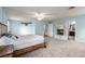 Spacious main bedroom with a fireplace, neutral carpet, and access to the main bathroom at 905 Possum Hill St, Henderson, NV 89014