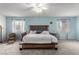 Relaxing main bedroom offers generous space, complemented by soft blue walls and natural light at 905 Possum Hill St, Henderson, NV 89014