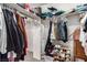 Organized walk-in closet with clothing, shoes, shelves, and racks at 905 Possum Hill St, Henderson, NV 89014