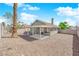 Backyard featuring covered patio, gravel landscaping, a mature tree and a block wall at 908 Coral Isle Way, Las Vegas, NV 89108
