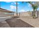 Backyard features a covered patio, gravel landscaping, block wall and some greenery at 908 Coral Isle Way, Las Vegas, NV 89108