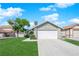 Charming single-story home with lush lawn and two car garage at 908 Coral Isle Way, Las Vegas, NV 89108