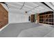 Spacious garage with shelving, storage and painted walls offers ample room for vehicles at 908 Coral Isle Way, Las Vegas, NV 89108