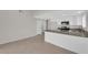 Open kitchen features a center island, stainless appliances, and tile floors at 908 Coral Isle Way, Las Vegas, NV 89108