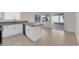 Modern kitchen featuring white cabinets, an island and ample counter space at 908 Coral Isle Way, Las Vegas, NV 89108