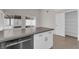 Kitchen island with stainless steel dishwasher and additional storage at 908 Coral Isle Way, Las Vegas, NV 89108