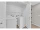 Laundry room with washer, dryer, and shelving at 908 Coral Isle Way, Las Vegas, NV 89108