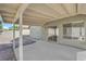 Covered patio showcases a view of the yard, gravel landscaping and block perimeter walls at 908 Coral Isle Way, Las Vegas, NV 89108