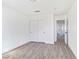 Bright bedroom features closet with sliding doors and wood-style floors at 9541 Summersweet Ct, Las Vegas, NV 89123