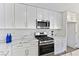 Updated kitchen with stainless steel appliances and marble countertops at 9541 Summersweet Ct, Las Vegas, NV 89123