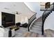 Living room features a fireplace and staircase with an open landing at 9541 Summersweet Ct, Las Vegas, NV 89123