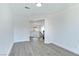 Living room showcasing wood floors, modern paint, and entry to stairs at 9541 Summersweet Ct, Las Vegas, NV 89123