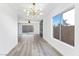 Bright living room features modern lighting and floor-to-ceiling sliding doors at 9541 Summersweet Ct, Las Vegas, NV 89123