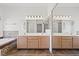 Primary bath featuring dual sinks, vanity, tub and large mirror at 9624 Twelve Pins Dr, Las Vegas, NV 89129