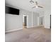 Large bedroom featuring neutral walls, carpet flooring, TV and walk in closet at 9624 Twelve Pins Dr, Las Vegas, NV 89129