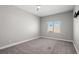 Neutral bedroom with a ceiling fan and a window at 9624 Twelve Pins Dr, Las Vegas, NV 89129