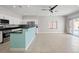 Bright living room featuring neutral walls, tile flooring and access to backyard at 9624 Twelve Pins Dr, Las Vegas, NV 89129
