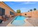 Backyard pool and spa with a fence at 9624 Twelve Pins Dr, Las Vegas, NV 89129