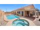 Backyard pool and spa with a covered patio at 9624 Twelve Pins Dr, Las Vegas, NV 89129