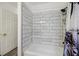 Tiled shower and tub combo with white subway tile and shower curtain at 9815 Ramhorn Canyon St, Las Vegas, NV 89183